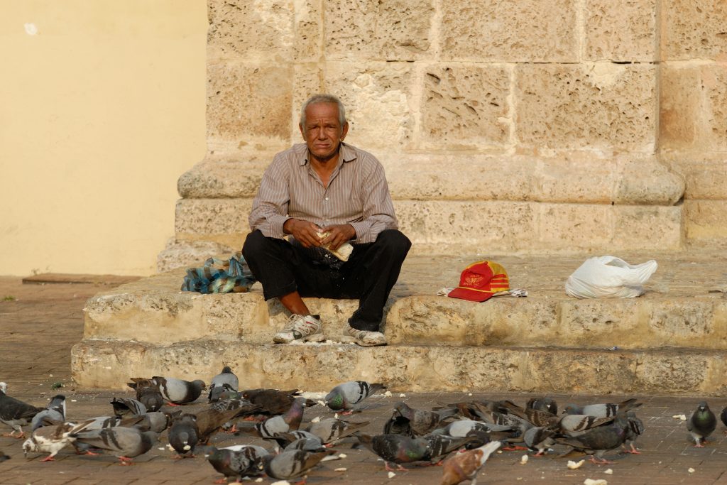 Feeding pigeons in front of San Pedro Claver Church, Cartagena